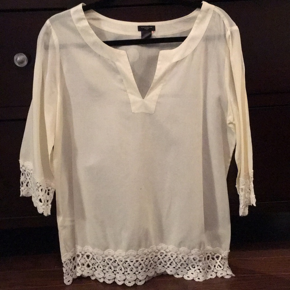 A white Ann Taylor blouse with a cute long v-neck.
